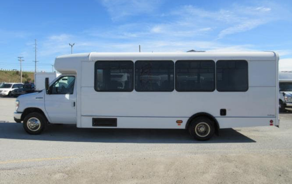 Side view of white 25 seater mini bus