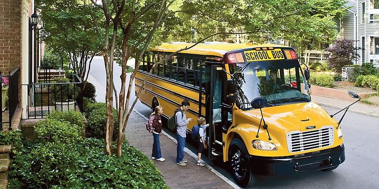 difference between coach and school buses